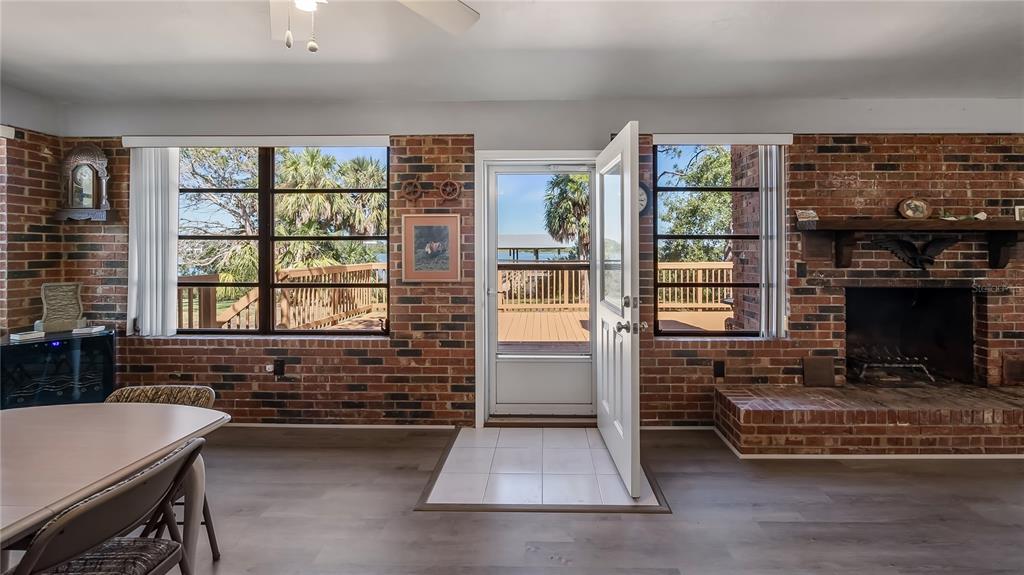 16317 Andrews Circle Cedar Key, FL 32625 - Photo 46 of 53 a living room with furniture a flat screen tv and a fireplace