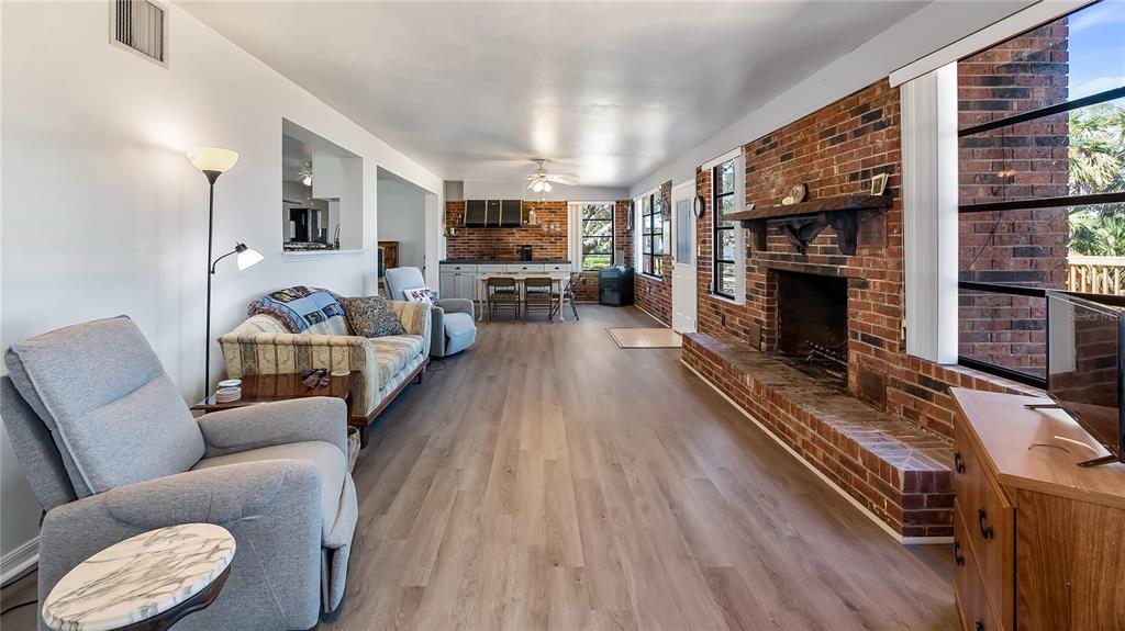 16317 Andrews Circle Cedar Key, FL 32625 - Photo 47 of 53 a living room with furniture and a fireplace