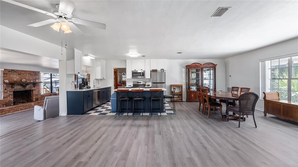 16317 Andrews Circle Cedar Key, FL 32625 - Photo 8 of 53 a living room with furniture and kitchen view