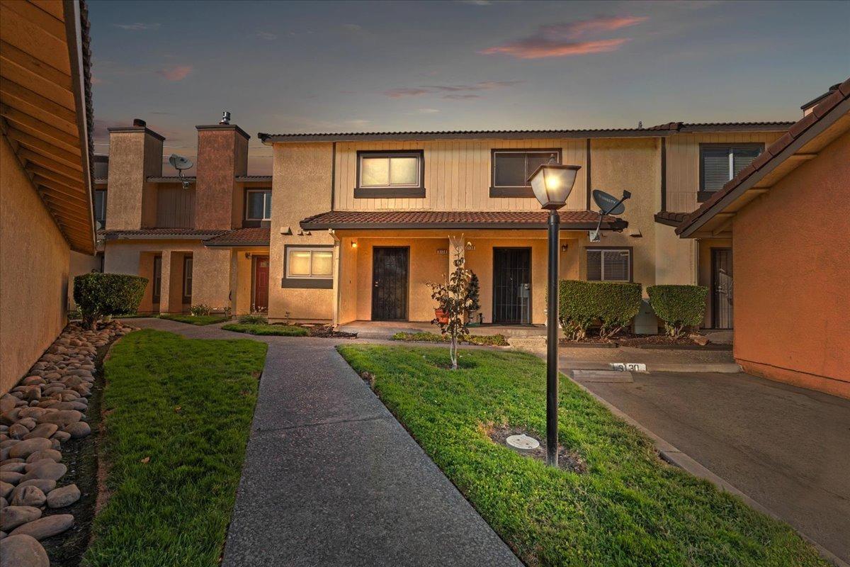 3128 Andre Lane Turlock, CA 95382 - Photo 1 of 1 front view of a house with a yard