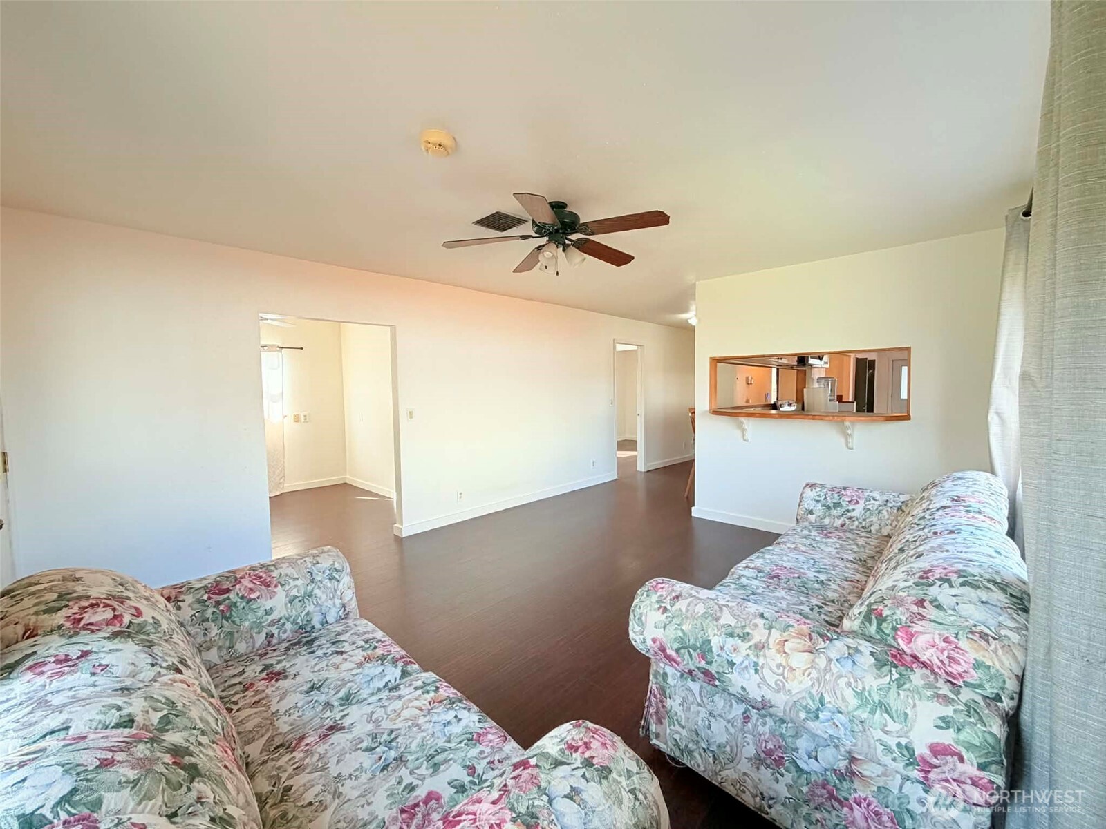 2006 West Second Street Aberdeen, WA 98520 - Photo 16 of 39 a bedroom with a bed and a chandelier