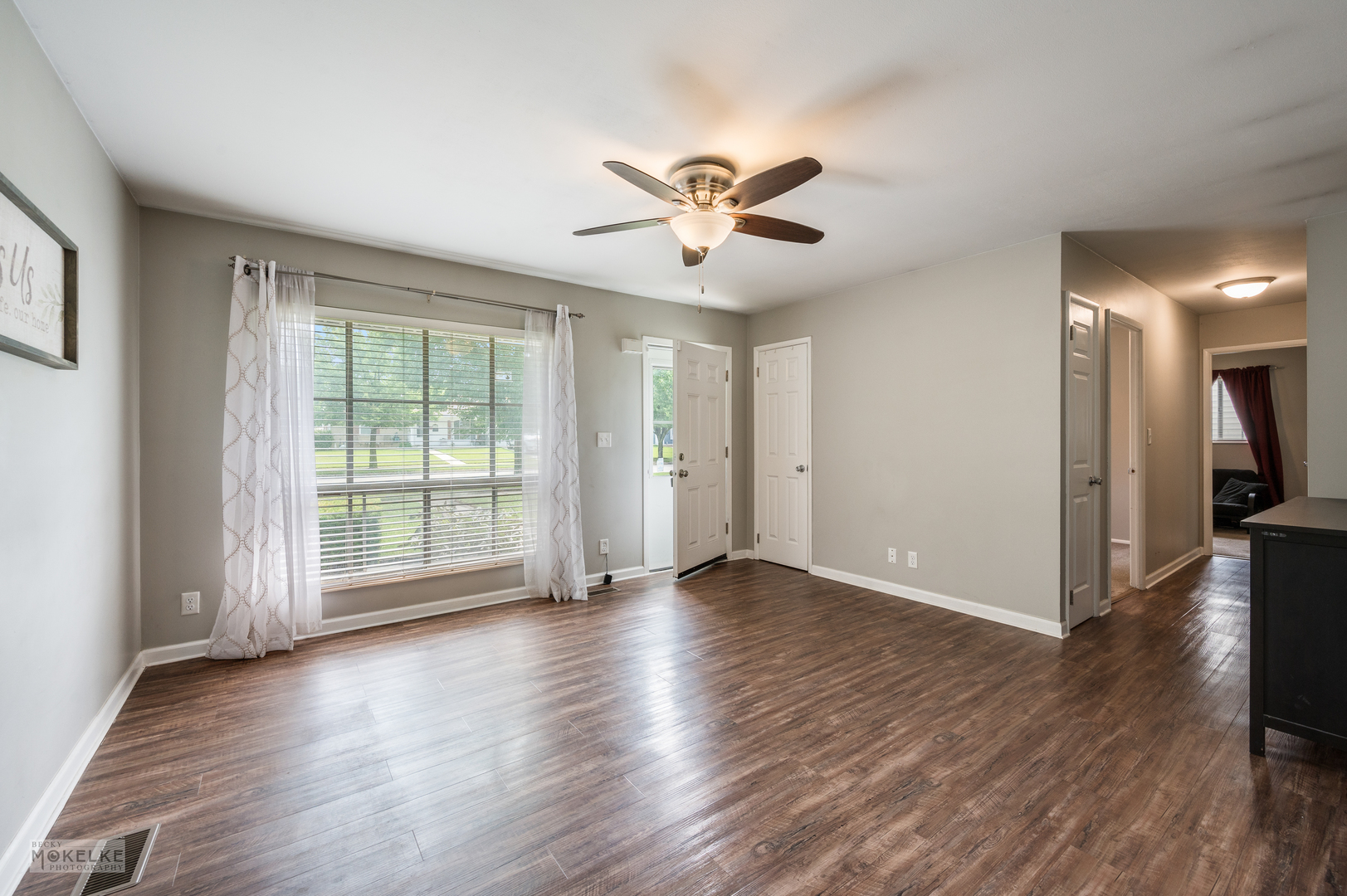 1270 Post Road Aurora, IL 60506 - Photo 5 of 18 a view of an empty room with wooden floor and a window