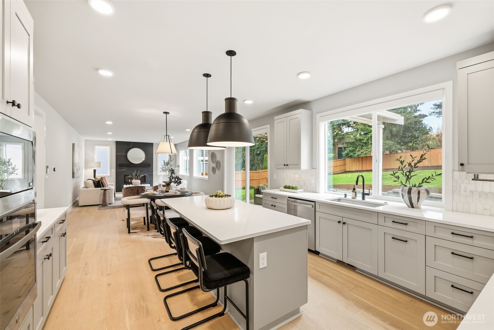 2944 215th Place Southwest Brier, WA 98036 - Photo 12 of 40 a kitchen with a sink a counter top space and stainless steel appliances