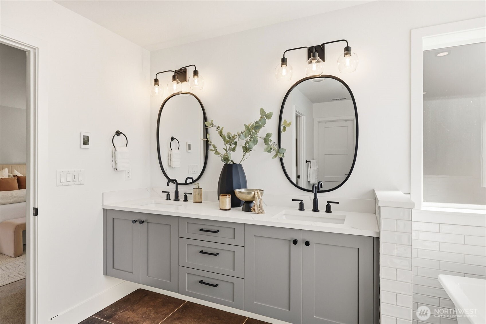 2944 215th Place Southwest Brier, WA 98036 - Photo 18 of 40 a bathroom with a double vanity sink and a mirror