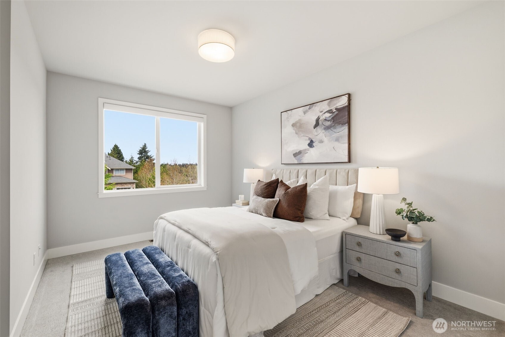 2944 215th Place Southwest Brier, WA 98036 - Photo 22 of 40 a bedroom with a bed and a painting on the wall