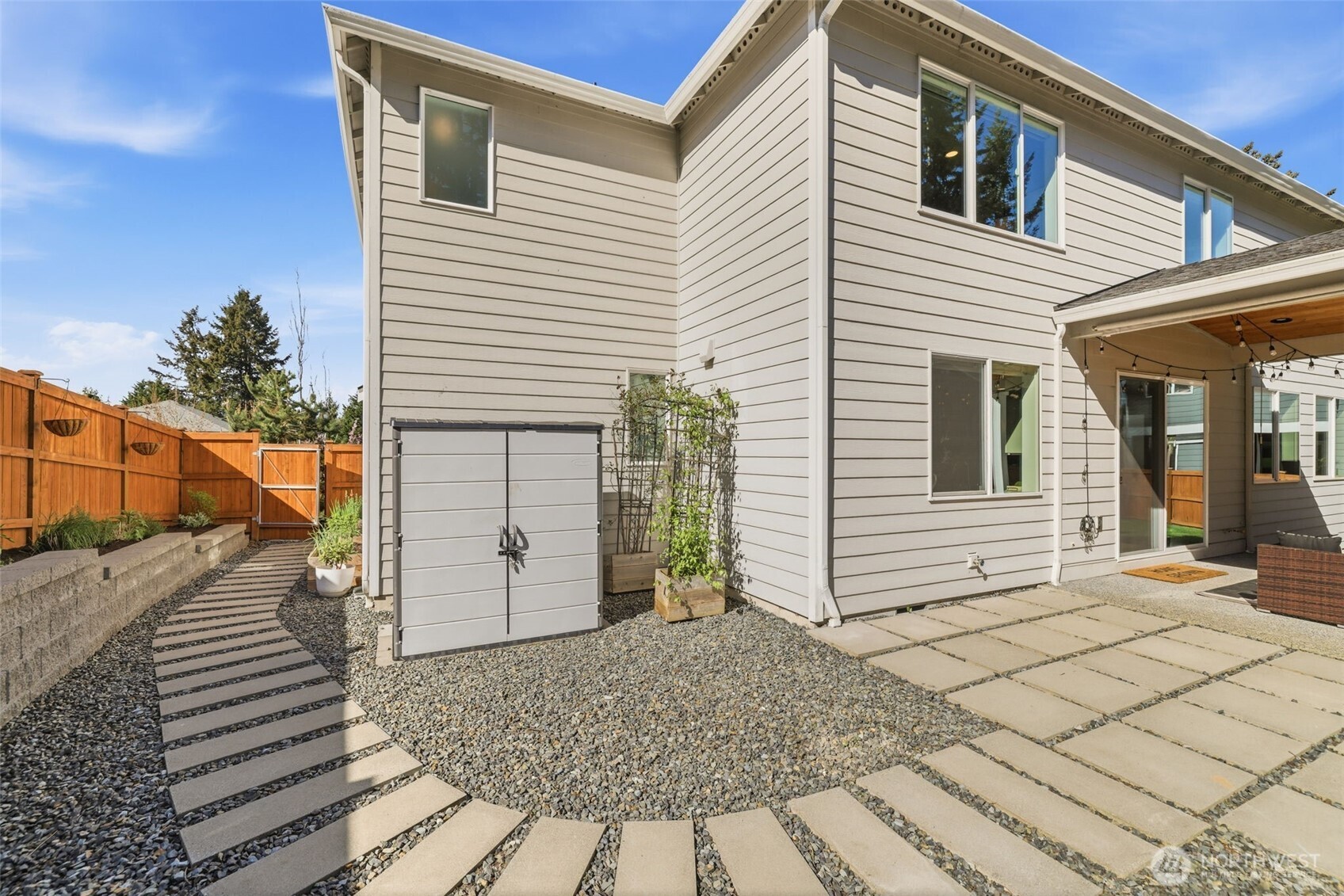 2944 215th Place Southwest Brier, WA 98036 - Photo 34 of 40 a view of a house with a door and wooden bench