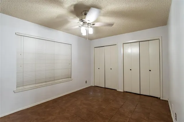 a view of an empty room with a fan