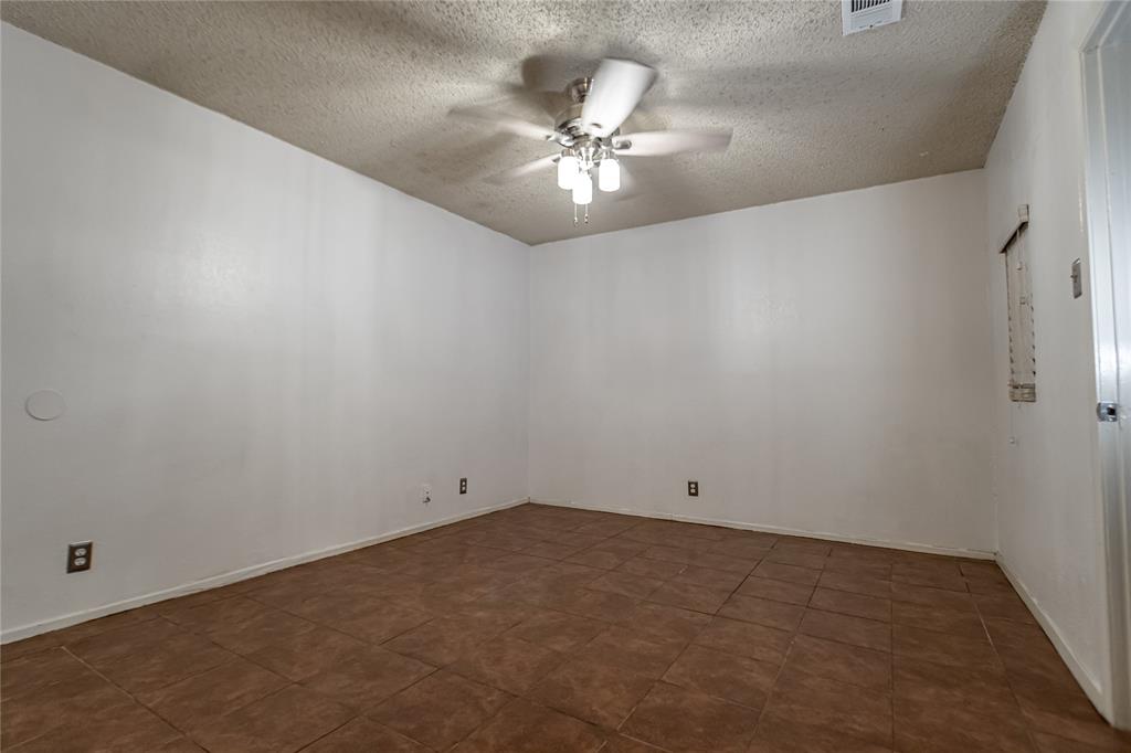 3327 Fallmeadow Street Denton, TX 76207 - Photo 24 of 31 en house with a ceiling fan