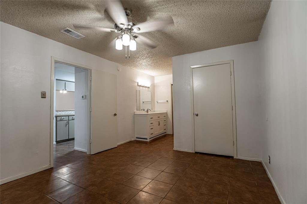3327 Fallmeadow Street Denton, TX 76207 - Photo 25 of 31 a view of a livingroom with a chandelier fan and windows