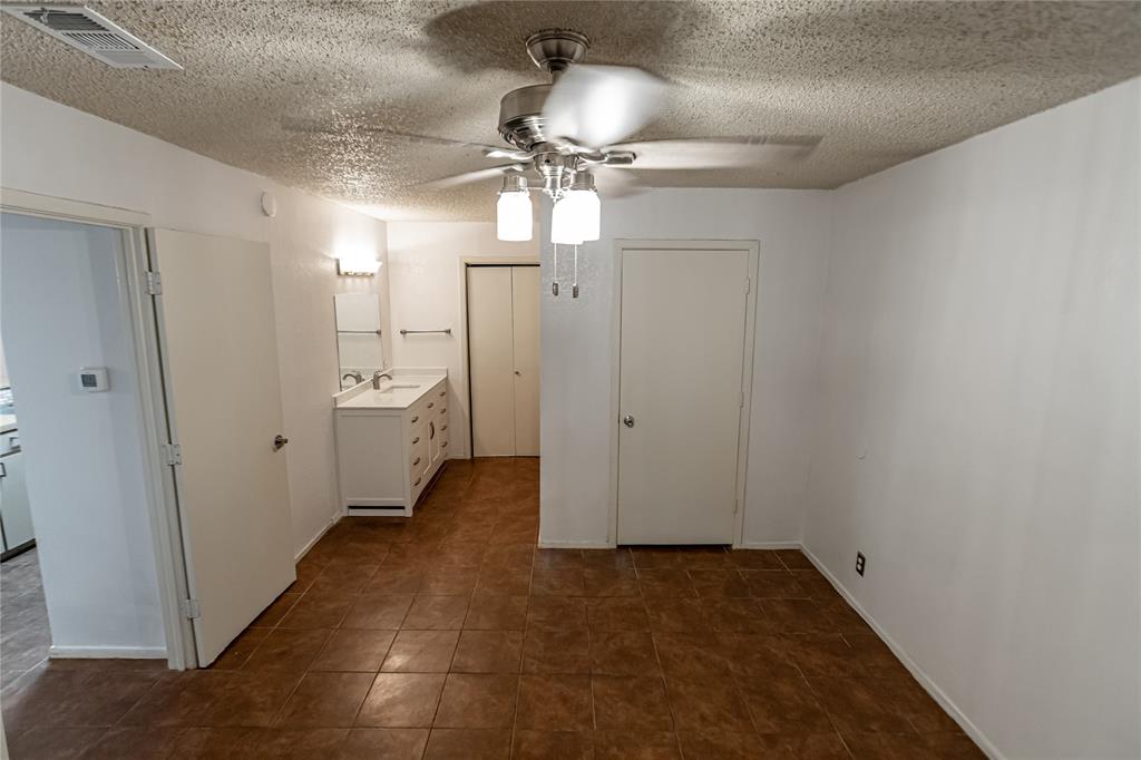 3327 Fallmeadow Street Denton, TX 76207 - Photo 27 of 31 a view of a hallway with an empty room