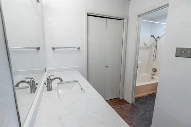 a bathroom with a sink a bathtub and a shower