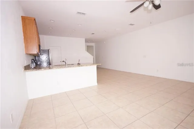 a bathroom with a bathtub sink vanity and mirror