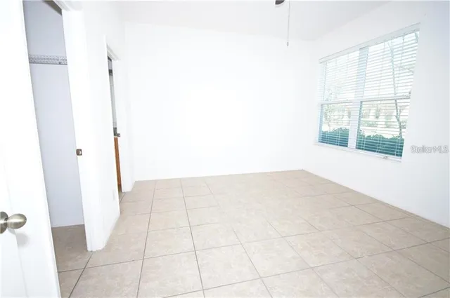 a view of an empty room and window