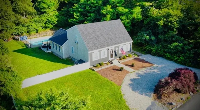 an aerial view of a house having yard