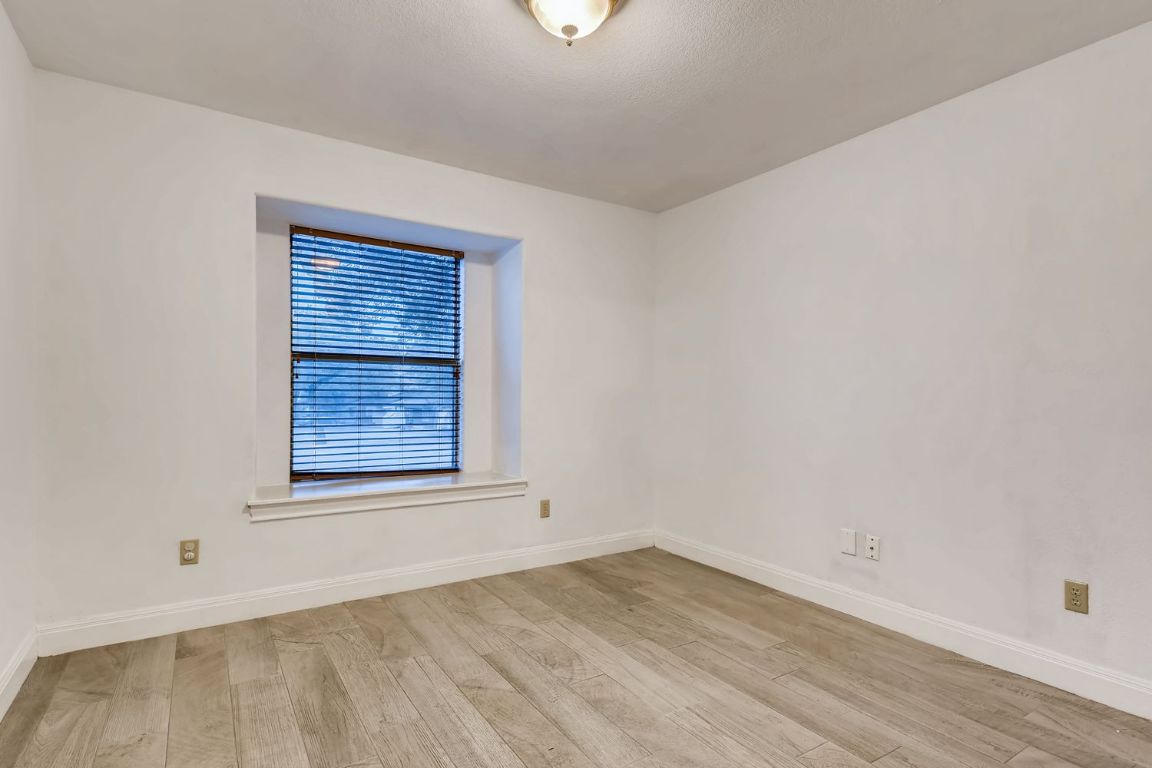 300 Venture Boulevard South Point Venture, TX 78645 - Photo 11 of 14 an empty room with a window