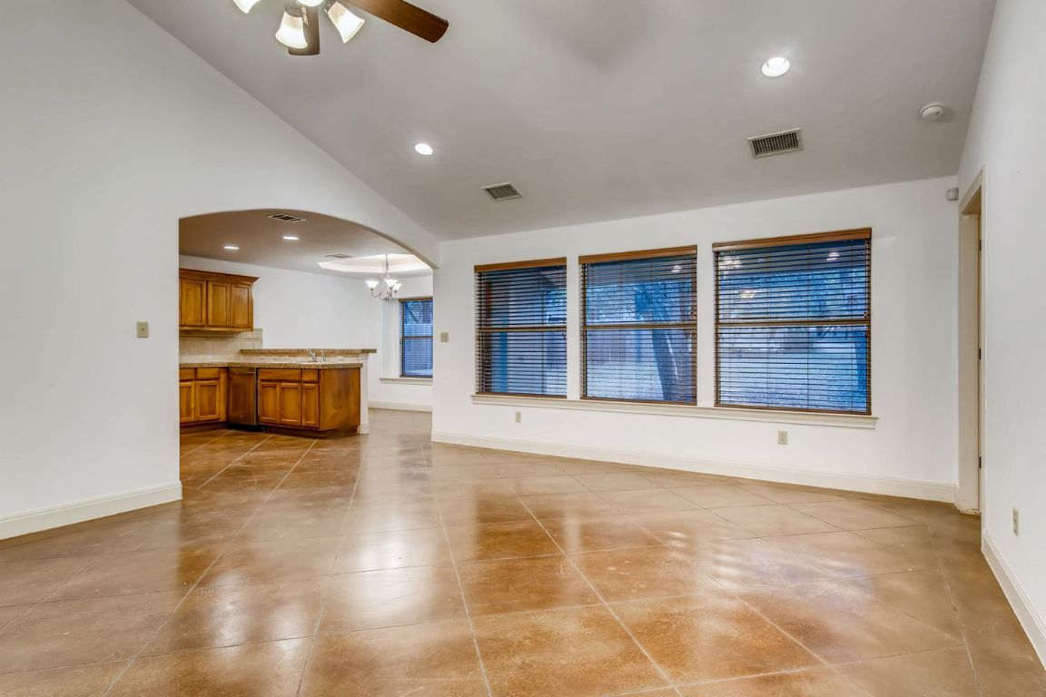 300 Venture Boulevard South Point Venture, TX 78645 - Photo 3 of 14 a view of an empty room with cabinet and wooden floor