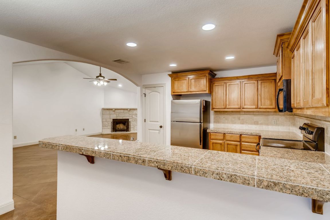 300 Venture Boulevard South Point Venture, TX 78645 - Photo 5 of 14 a bathroom with double vanity and a tub