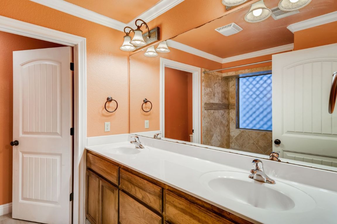 300 Venture Boulevard South Point Venture, TX 78645 - Photo 9 of 14 a bathroom with a sink and a mirror