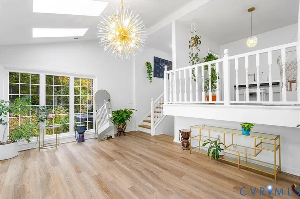 a living room filled with furniture window and a wooden floor