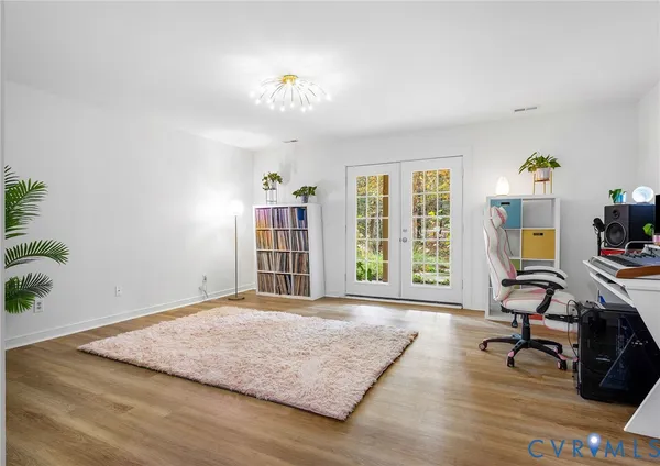 a bedroom with furniture and a window