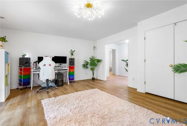 a view of livingroom with furniture and gym equipment
