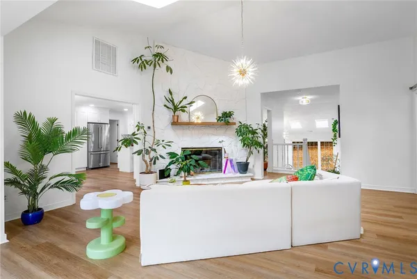 a view of living room with furniture and a chandelier