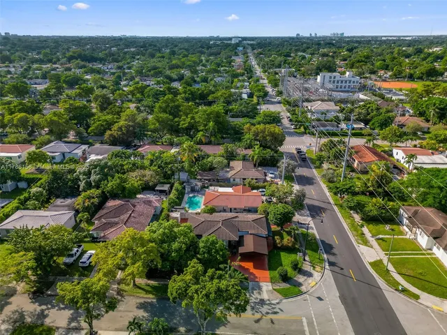 an aerial view of a house with a garden