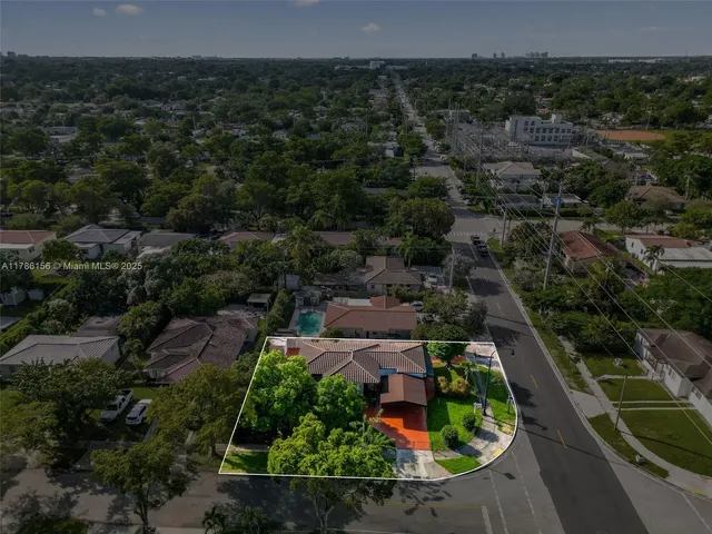 an aerial view of a house with a garden