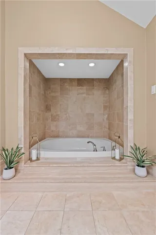 a bathroom with a bathtub and a shower