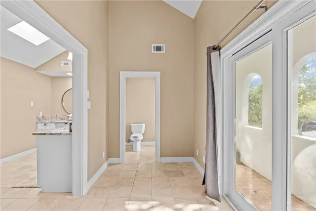 a view of a bathroom from a hallway