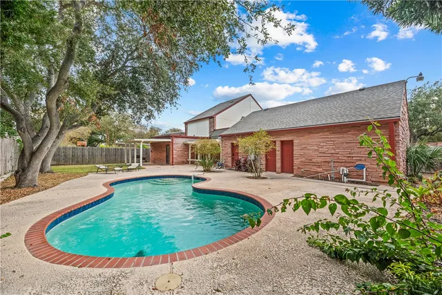 a view of a swimming pool with a patio