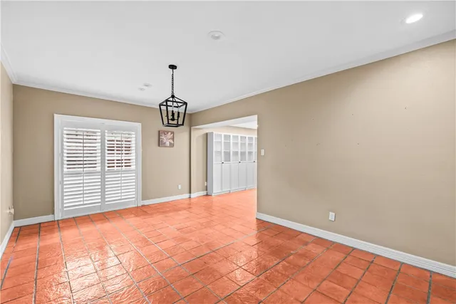 a view of an empty room with windows