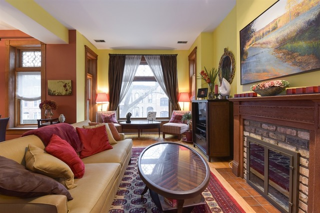 549 West Belden Avenue, Unit 2FE Chicago, IL 60614 - Photo 4 of 10 a living room with furniture a fireplace and large windows