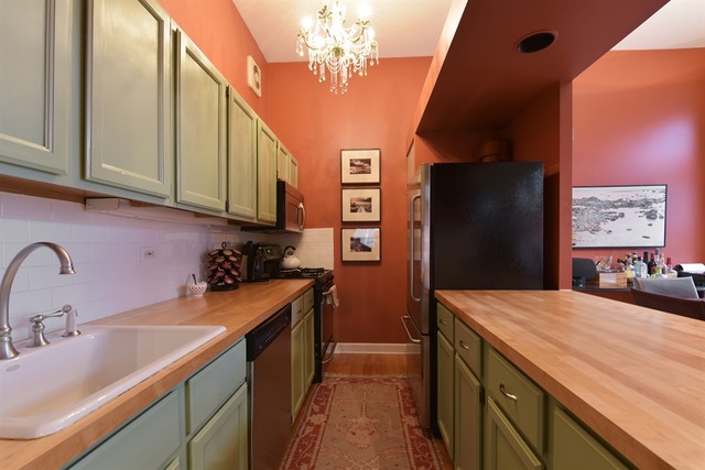 549 West Belden Avenue, Unit 2FE Chicago, IL 60614 - Photo 5 of 10 a kitchen with a sink stove and refrigerator