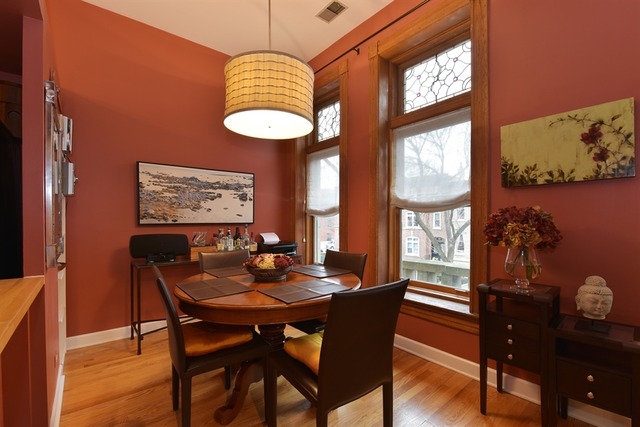 549 West Belden Avenue, Unit 2FE Chicago, IL 60614 - Photo 6 of 10 a dining room with furniture a rug and a large window