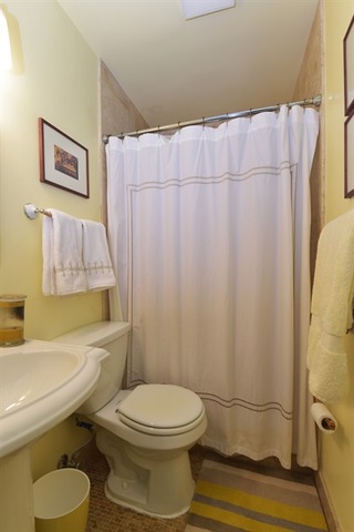 549 West Belden Avenue, Unit 2FE Chicago, IL 60614 - Photo 10 of 10 a bathroom with a toilet and a shower curtain
