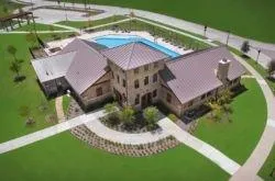 an aerial view of residential house with outdoor space and swimming pool