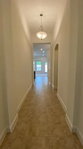a view of a bathroom with a sink and mirror