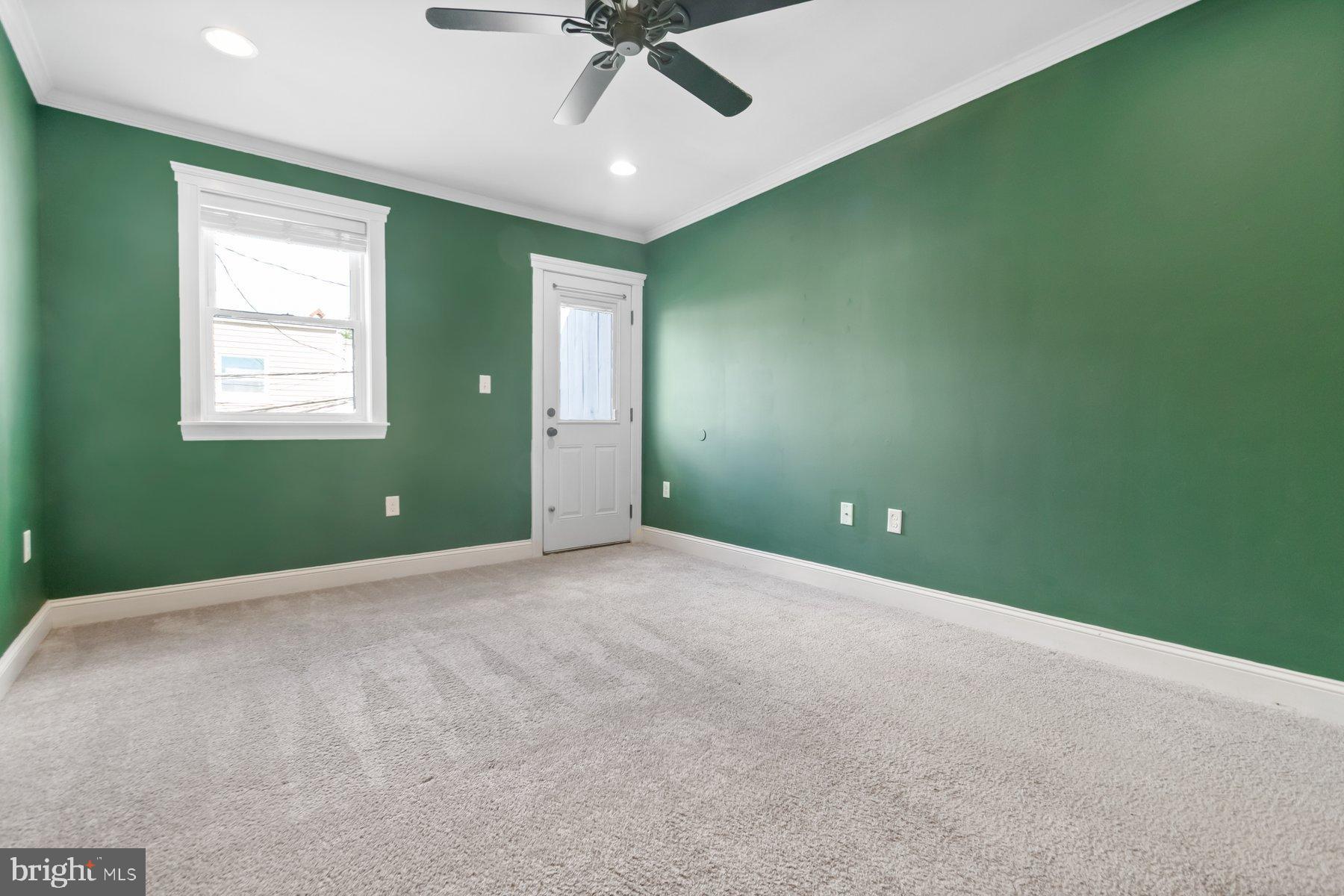 1614 Clarkson Street Baltimore, MD 21230 - Photo 21 of 31 Vibrant green walls enhance spacious charm.