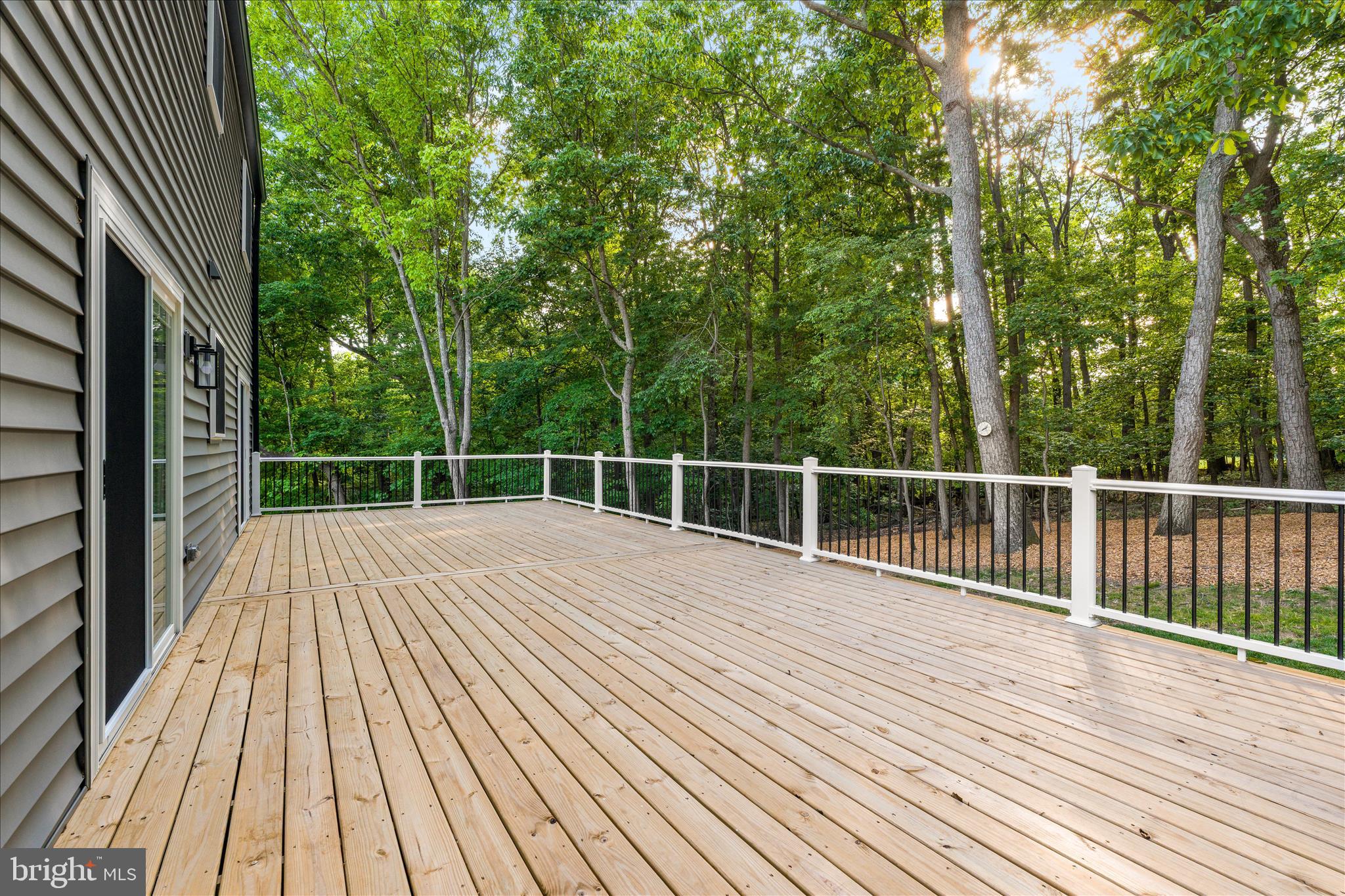 3908 Shakespeare Way Monrovia, MD 21770 - Photo 32 of 59 a view of backyard with wooden floor and fence