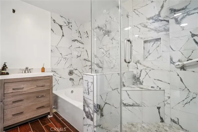 a bathroom with a bathtub and shower