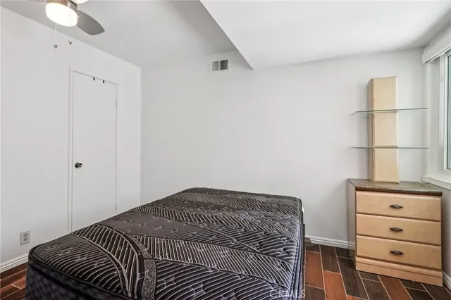 a bedroom with a bed and a cabinets