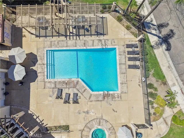 a view of roof deck with dining table and chairs