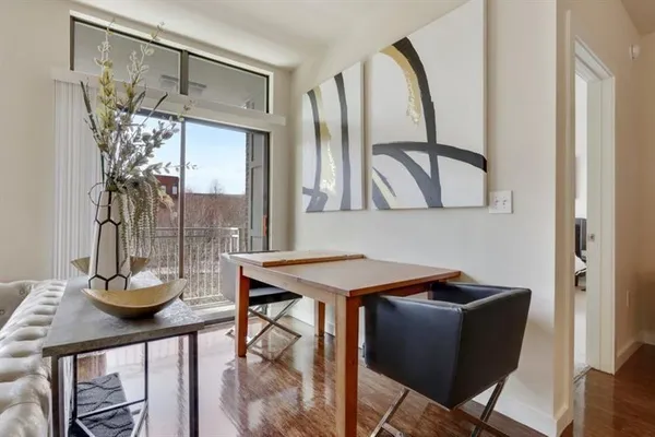 a view of a dining room with furniture and window