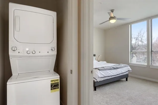 a bedroom with a bed and a mirror
