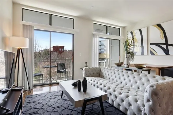a living room with furniture and a window
