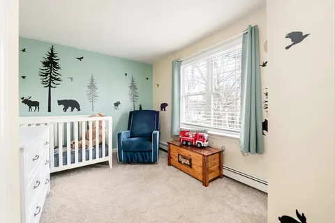 a bedroom with furniture and a window