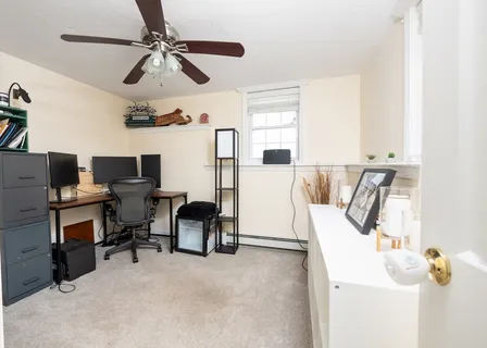 a view of a workspace with furniture