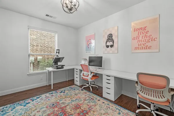 a workspace with furniture and window