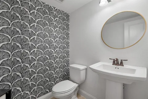 a bathroom with a toilet and a sink